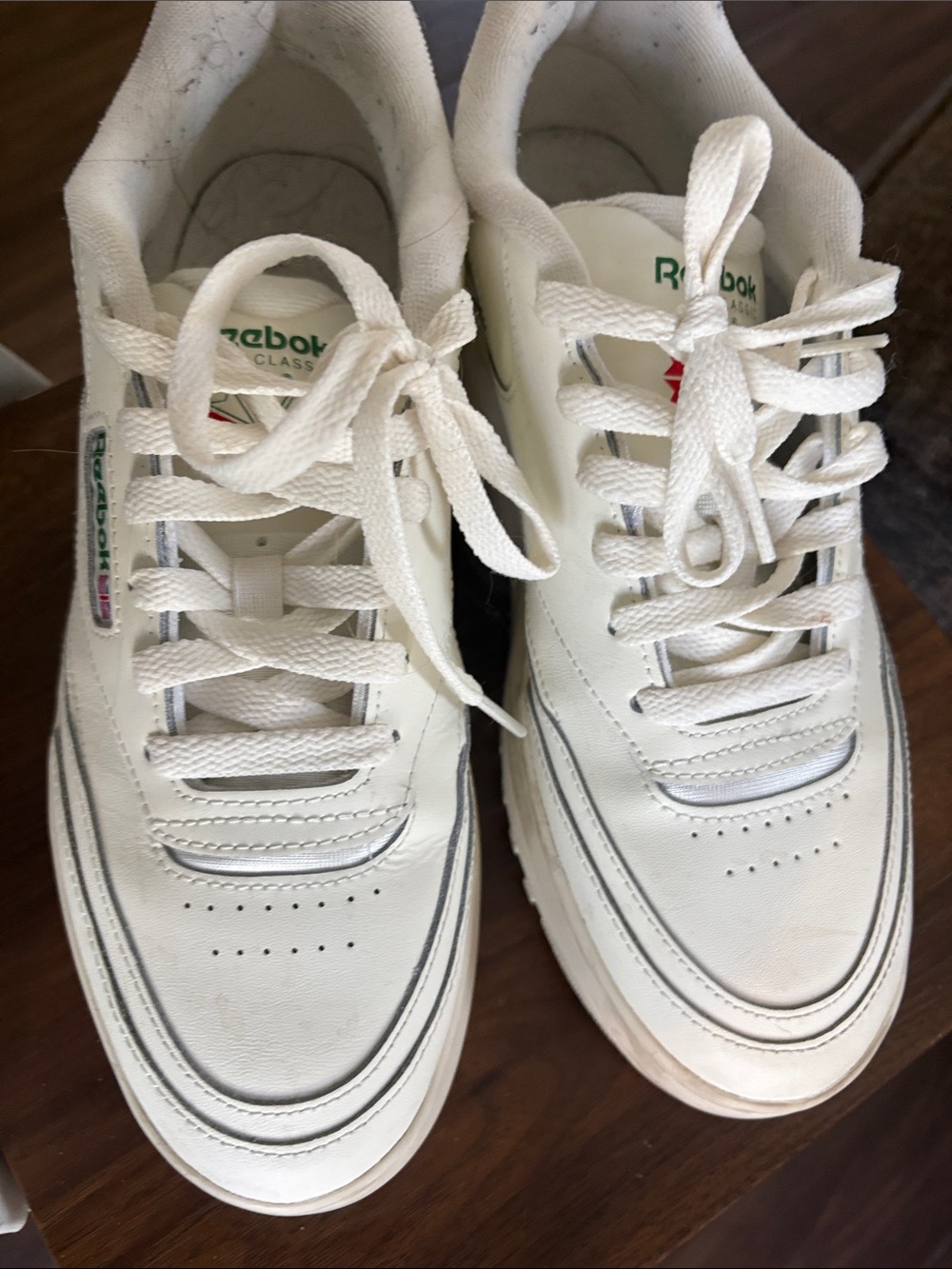 Reebok white leather sneakers with green and red logo accents